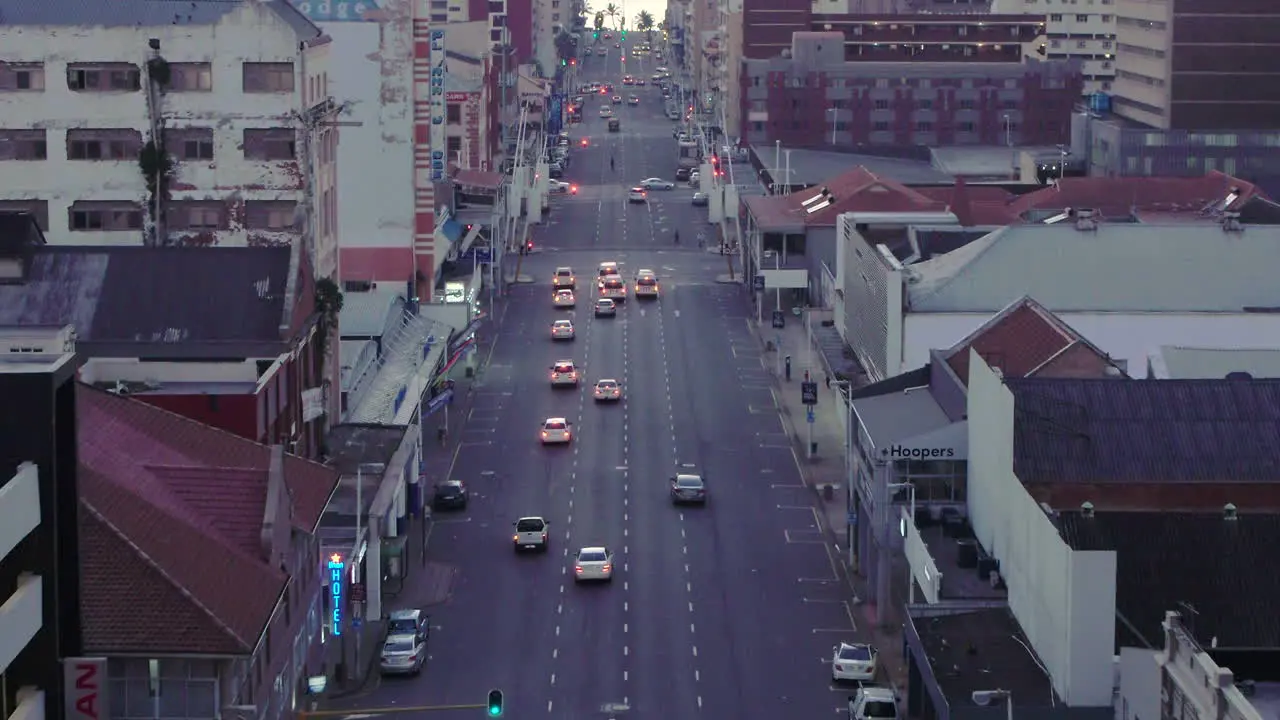 Early morning aerial drone shot through Durban city centre in South Africa cars and taxis driving along the roads