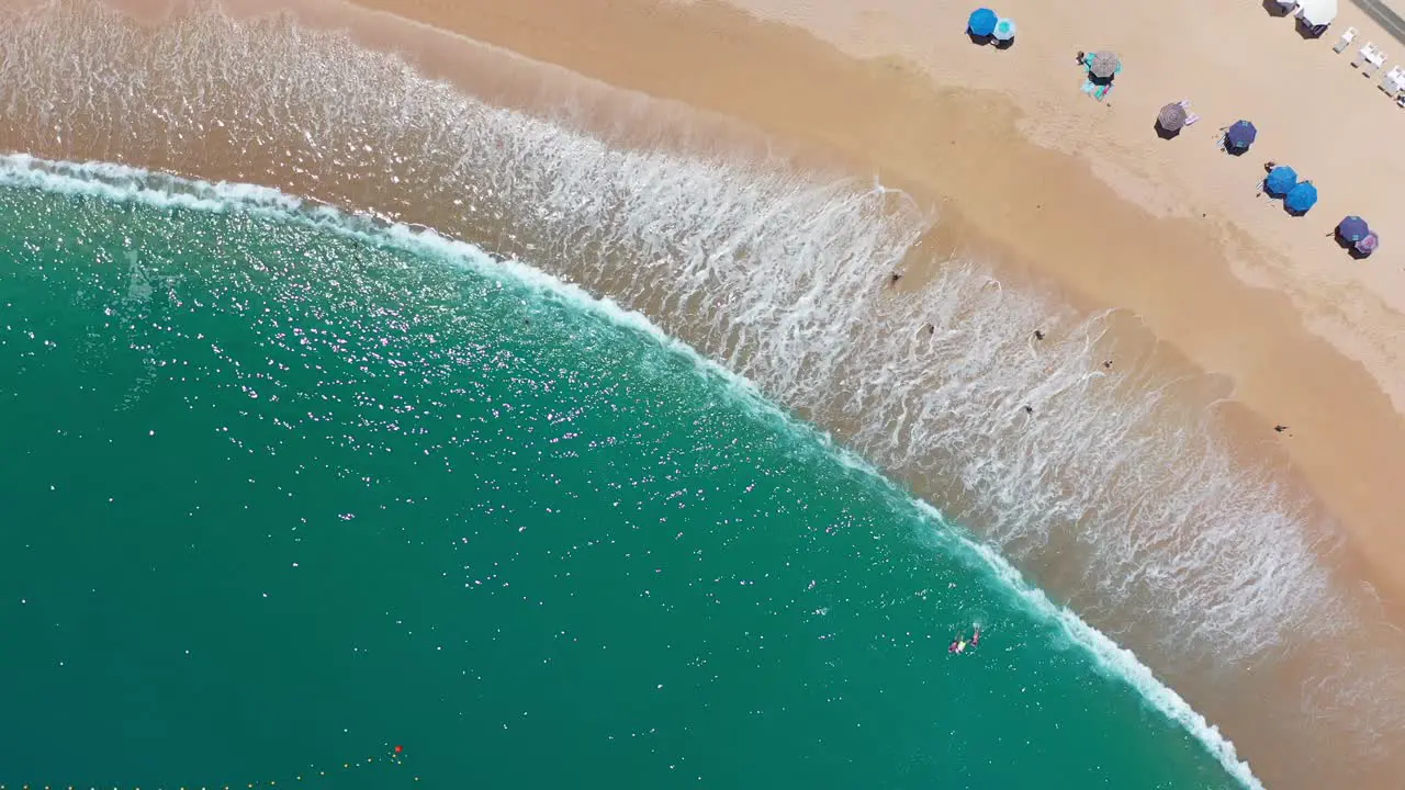 Aerial top down view over a beach in Los Cabos Mexico