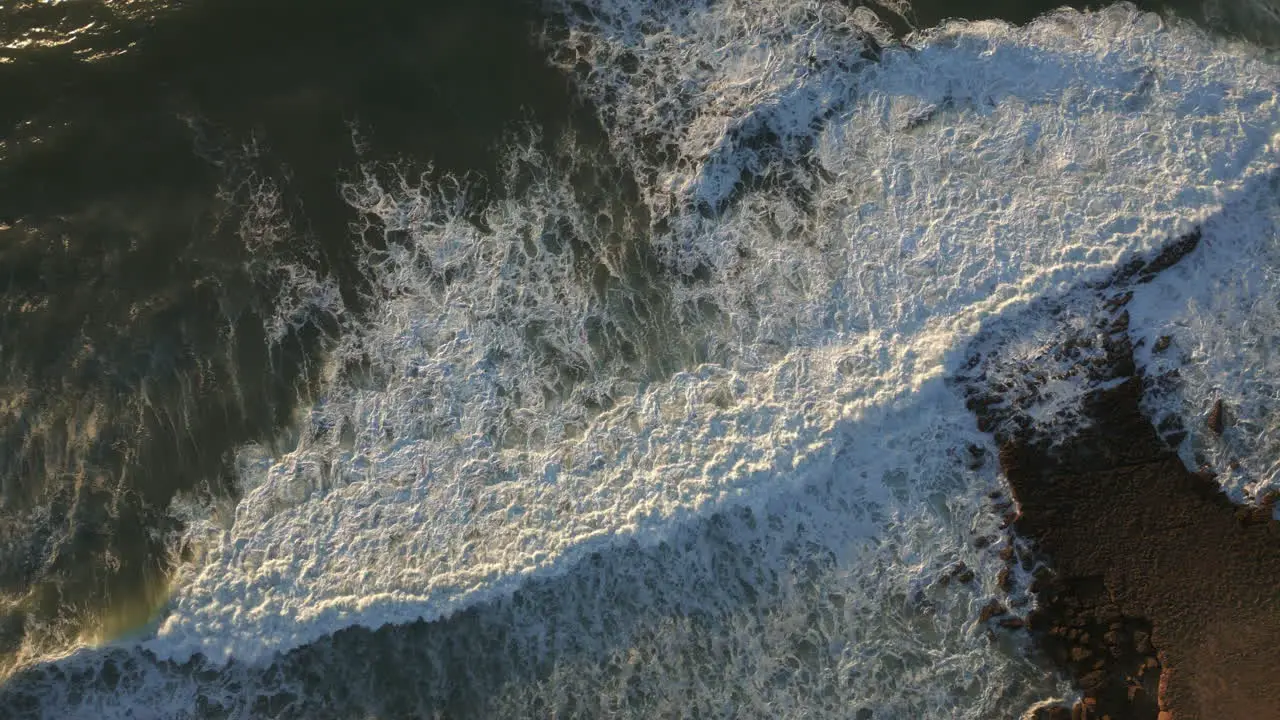 Top down shot of waves breaking at Ericeira Portugal