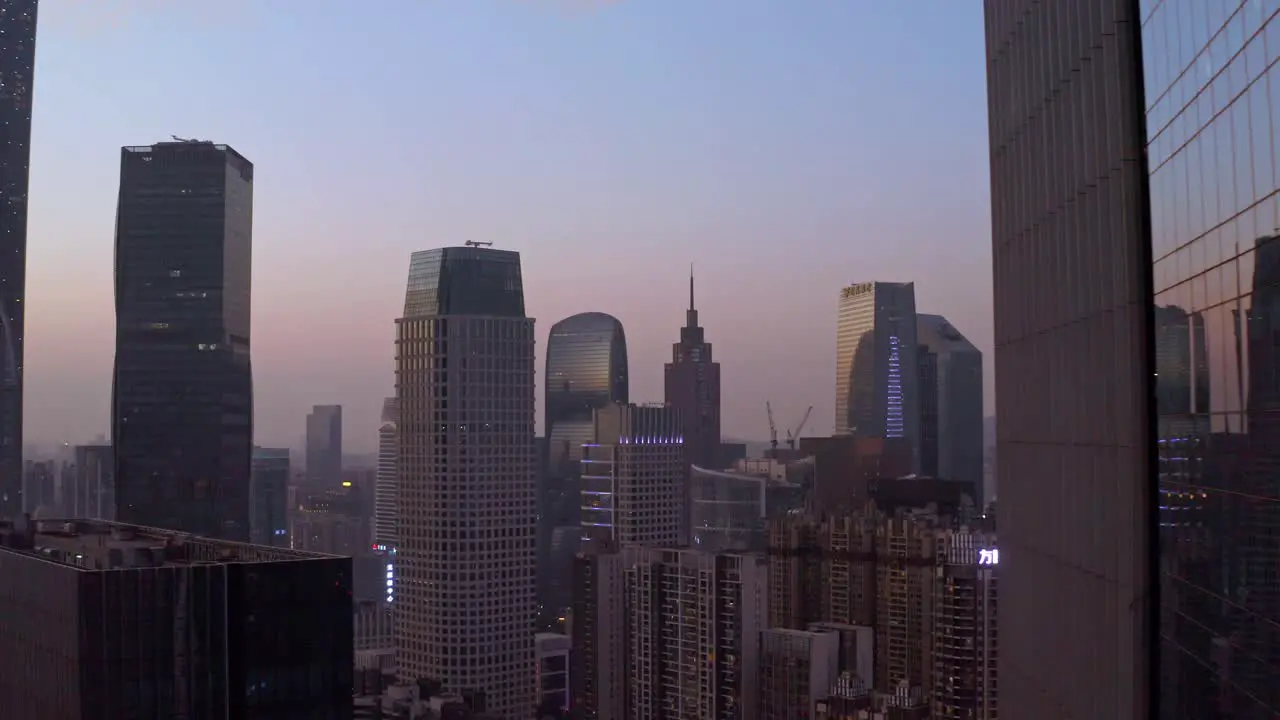 View on Guangzhou downtown CBD office buildings in rays of beautiful colorful sunset