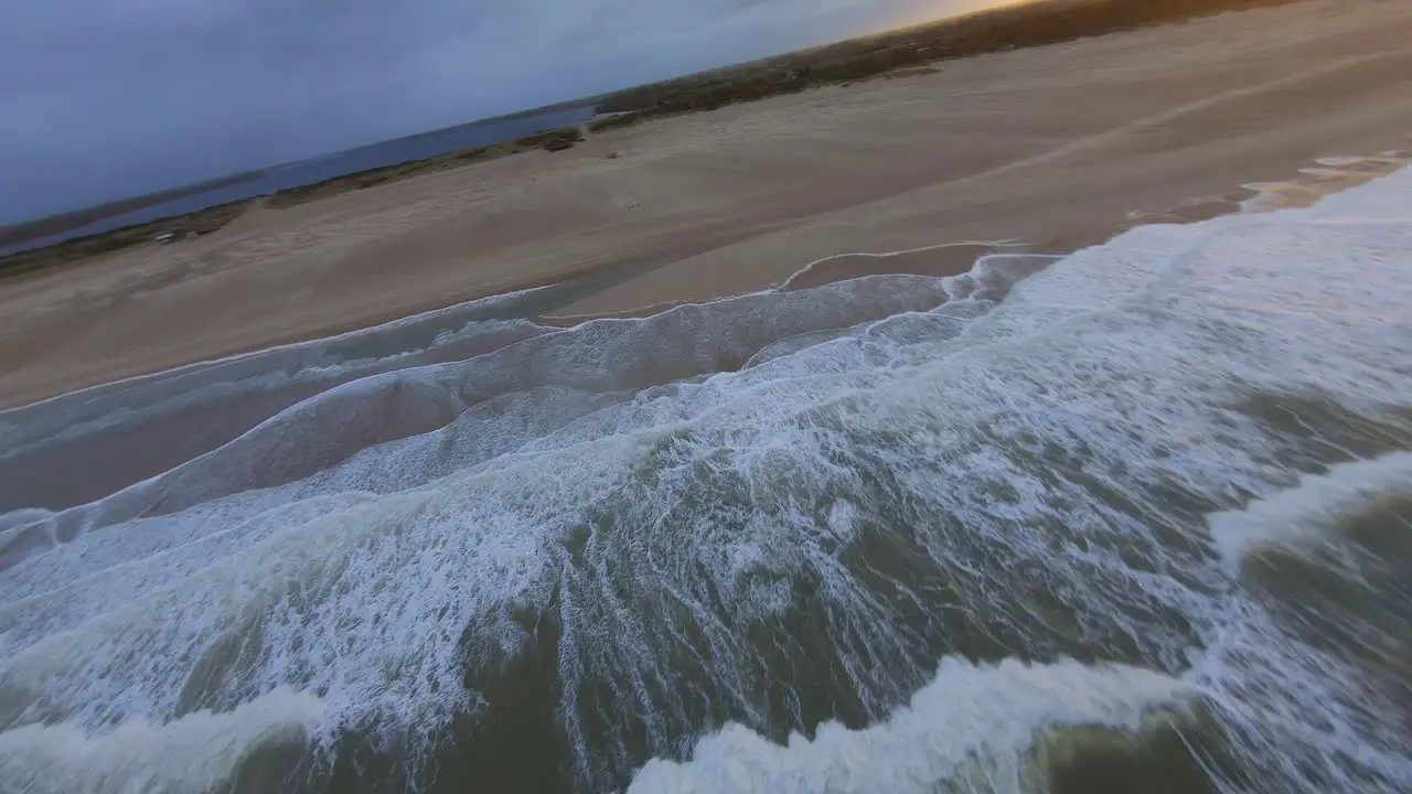 Orbit shot around a kitesurfer jumping at a beach in the Netherlands