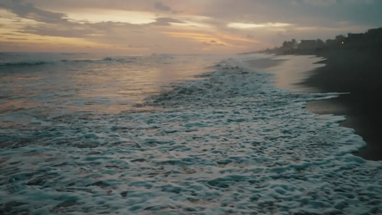 Tilt-up Revealed Rough Waves Over Sandy Shoreline At Dusk