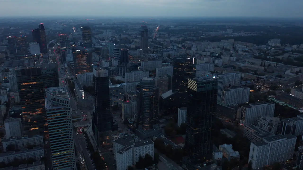 Aerial panoramic footage of downtown at twilight High rise office buildings in city centre Warsaw Poland