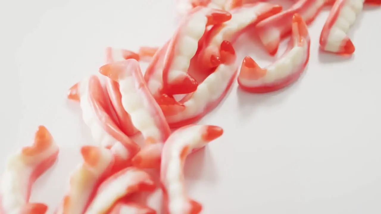 Close up view of halloween sour patch candies fallen against grey background