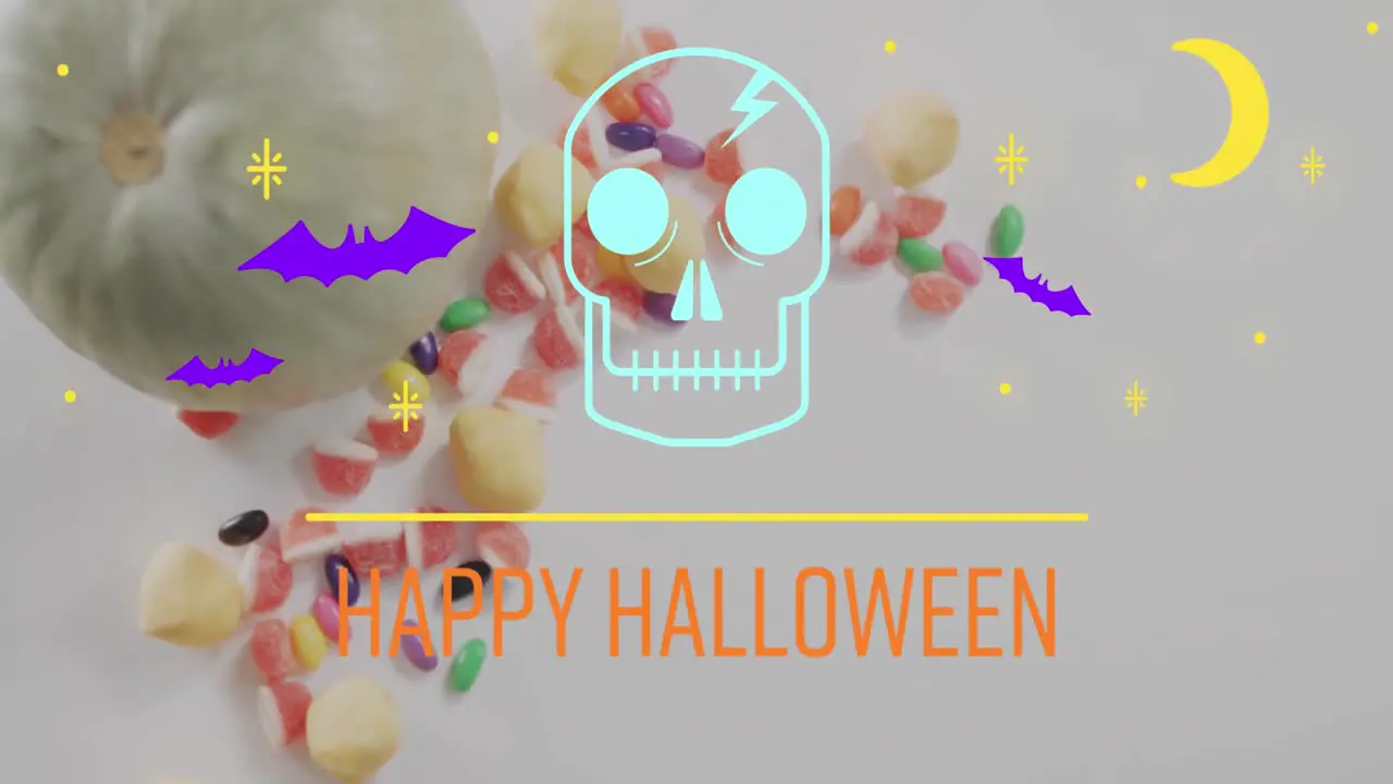 Animation of happy halloween text over bats pumpkin and sweets