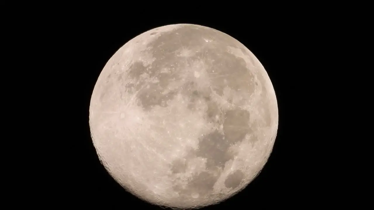 Capture the moon's mesmerizing details with this close-up telephoto lens footage