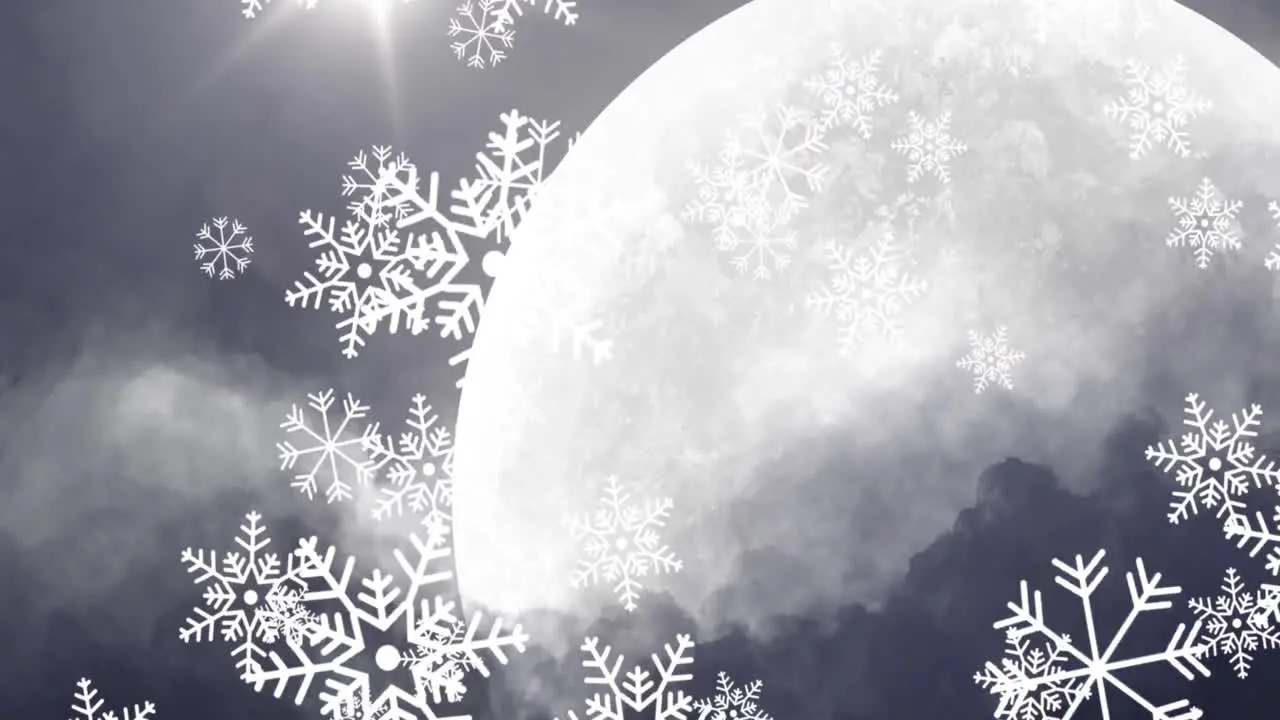 Snow particles falling against moon in night sky