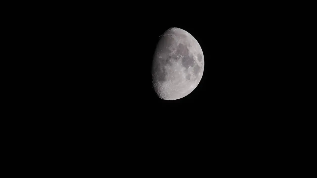 Waxing Gibbous Three Quarter Moon In Black Night Sky 4K