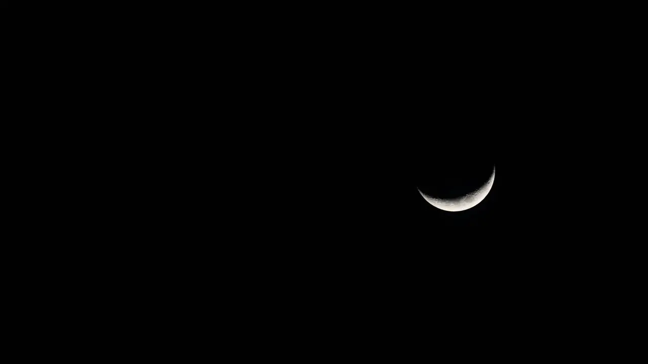 Waxing Crescent Moon 4K Time Lapse Descending Moon from the top going down to the right corner