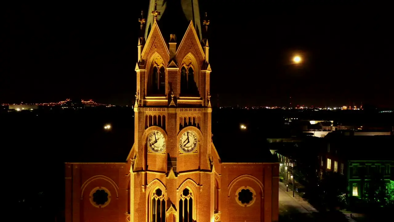 Flying upwards and revealing a beautiful steeple with a full moon on Friday the 13th