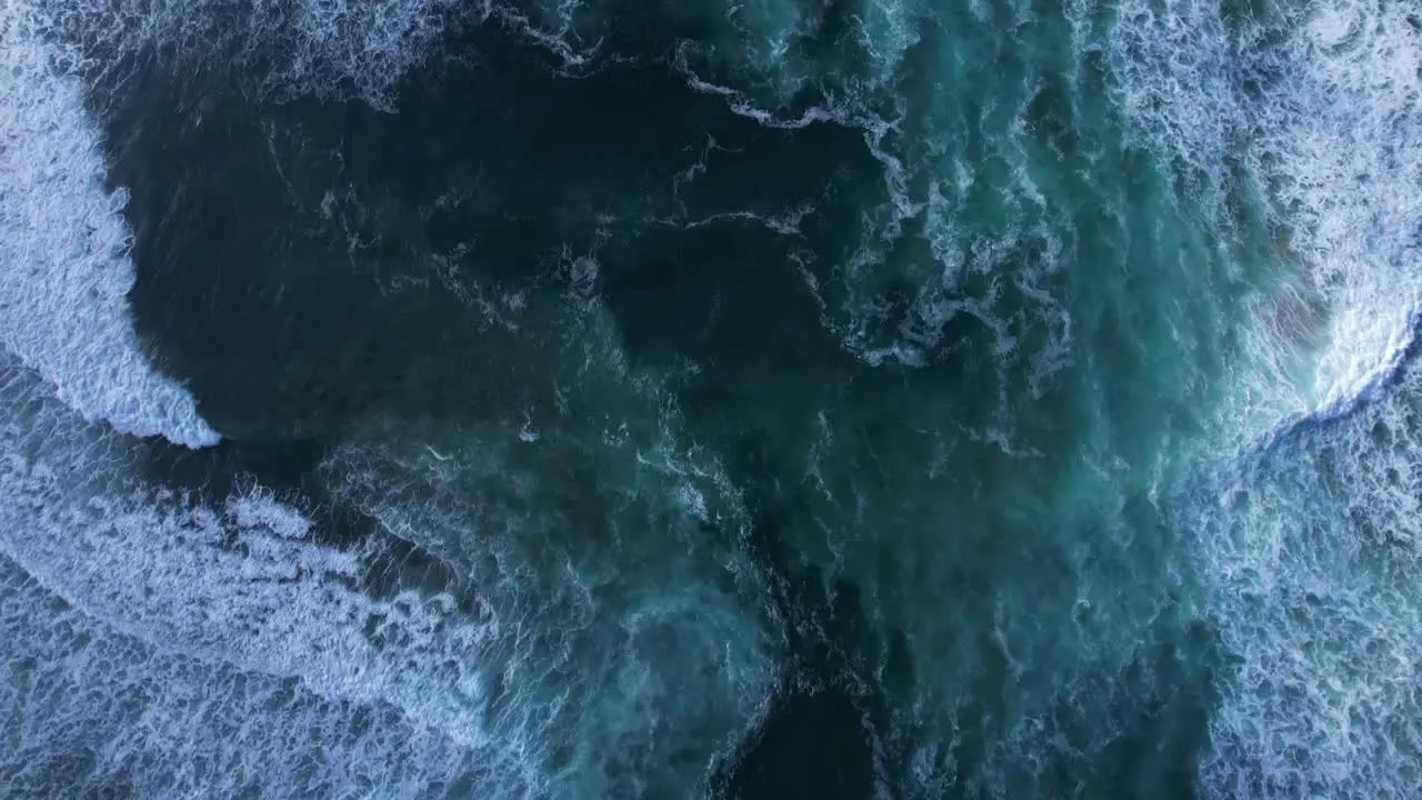 Waves washing onto Northern California beach near San Francisco Straight down shot