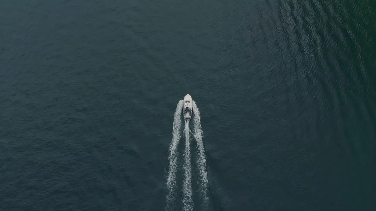 Aerial view of a motor boat in the distance