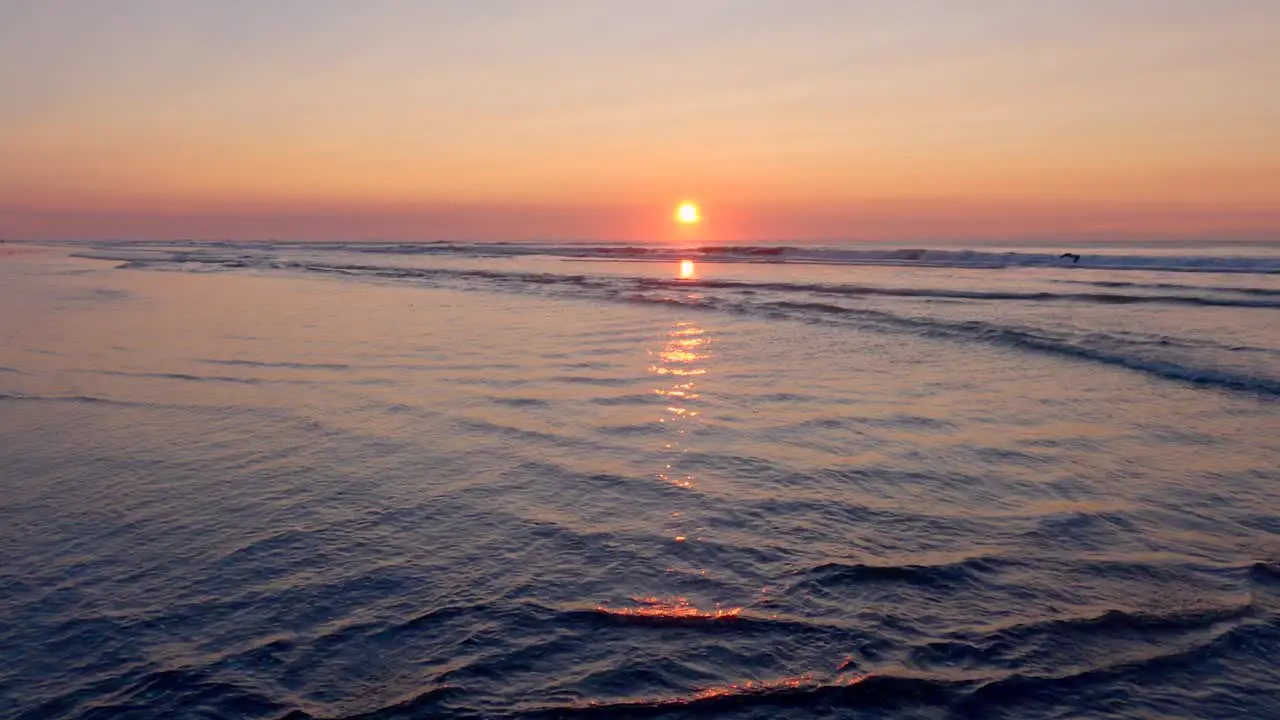 Gentle Waves on the Beach at Sunrise