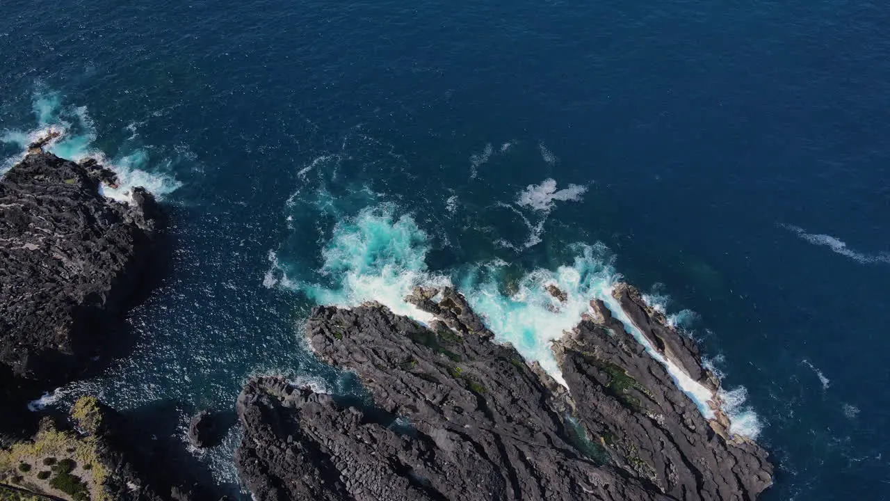 Aerial topdown view of some basaltic rocks in the coastline of Pico Island Azores