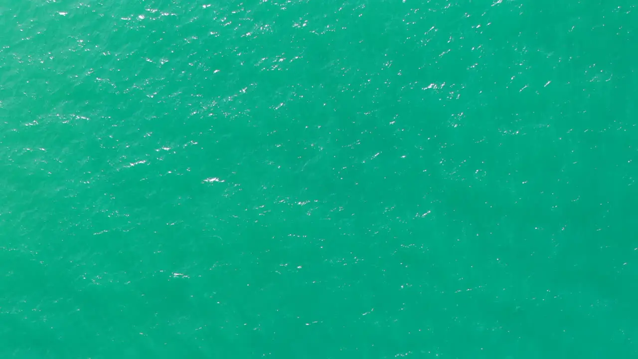 Flying over an emerald green mexican sea