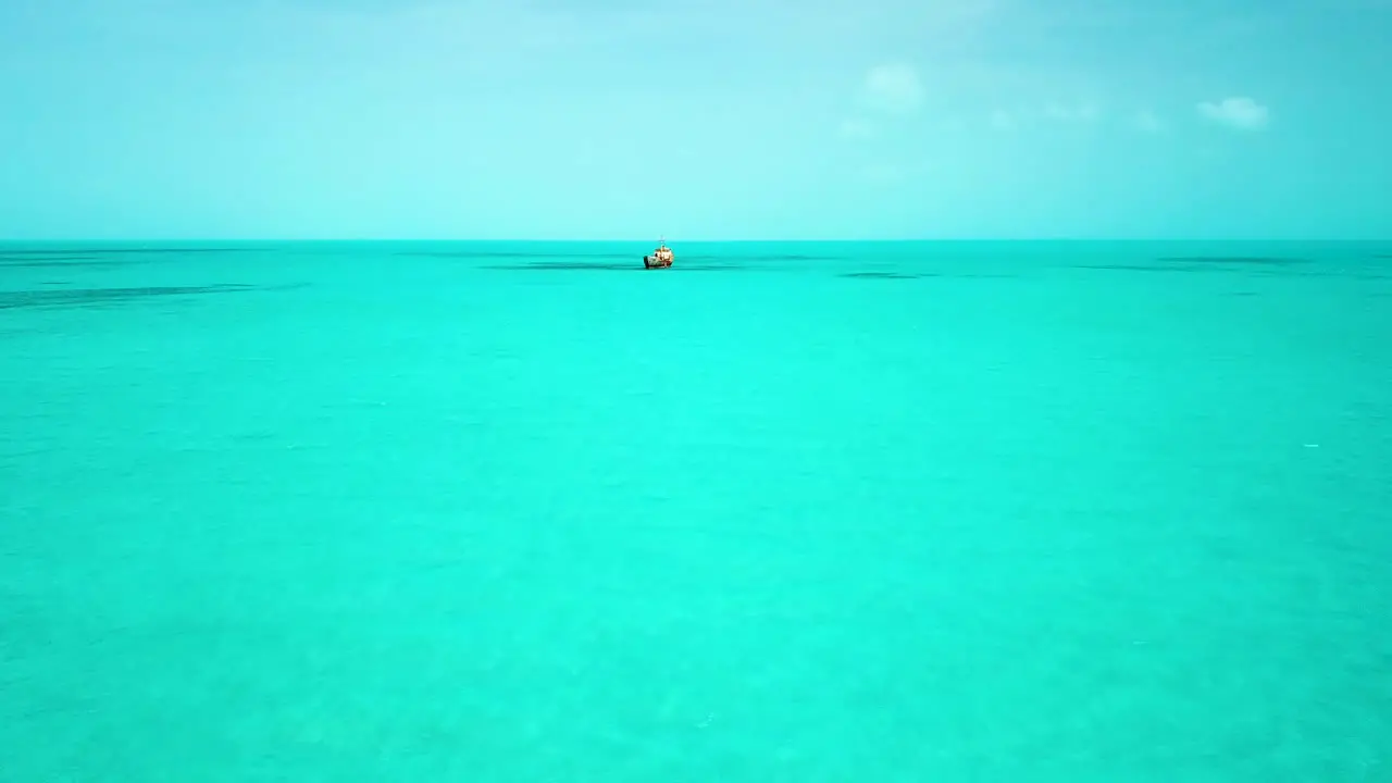 Aerial shot heading towards the La Famille Express Shipwreck off the coast of Providenciales in the Turks and Caicos archipelago