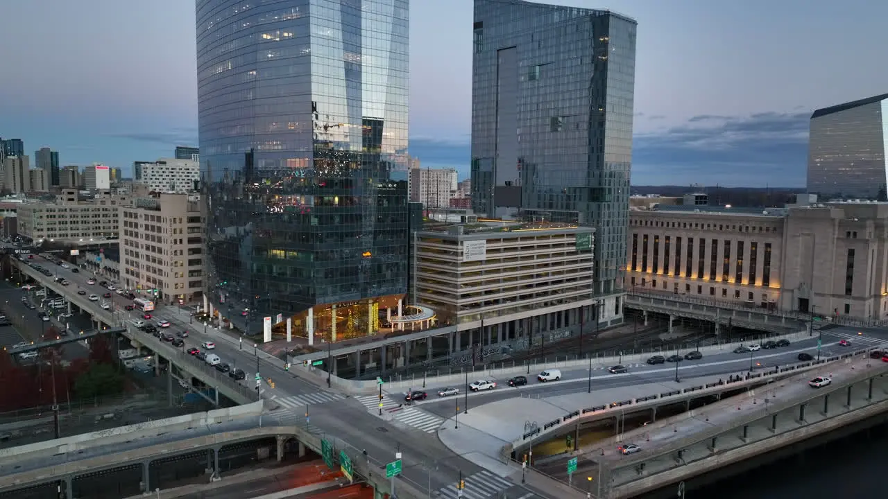 Rising aerial of skyscrapers and FMC buildings 30th St Train Station at sunrise