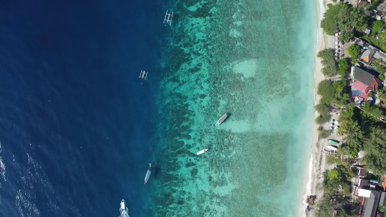 Drone shot watching boats go past the Indonesian coast line