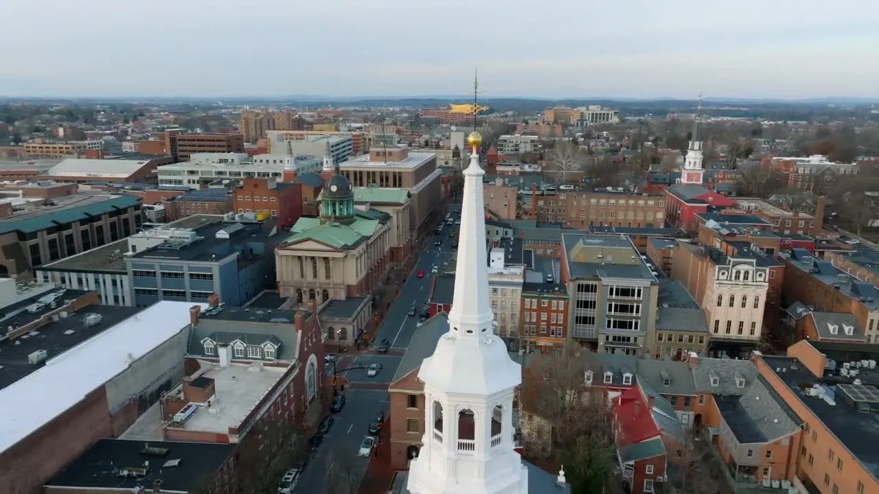 Aerial orbit around church steeple in downtown Lancaster City in Pennsylvania USA