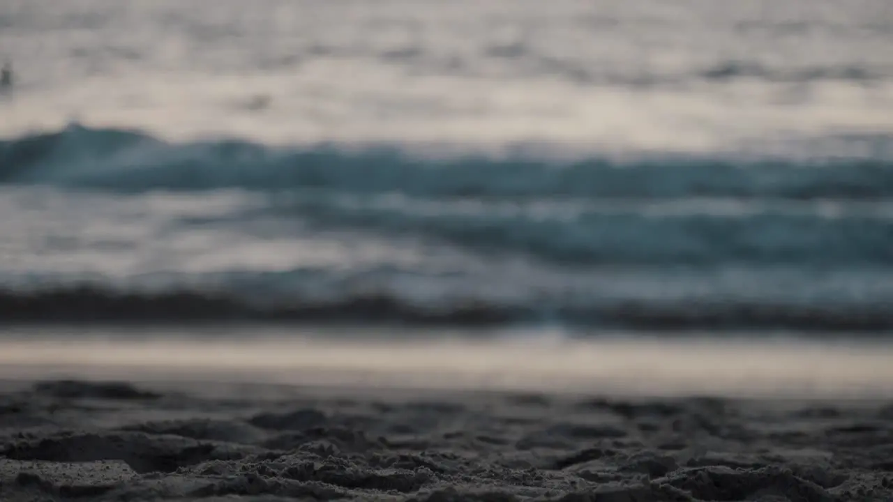 Beautiful shot of waves and the sand at the beach in Puerto Escondido