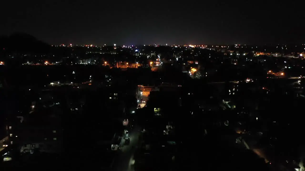 Drone footage of Beach with a backwater opening to it with a city skyline with high rises in backdrop