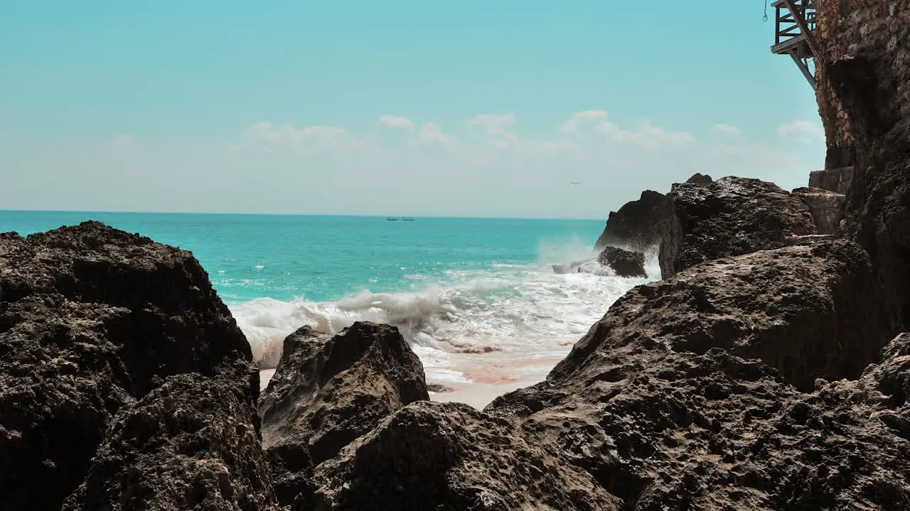 Huge aqua waves crashing on rocks