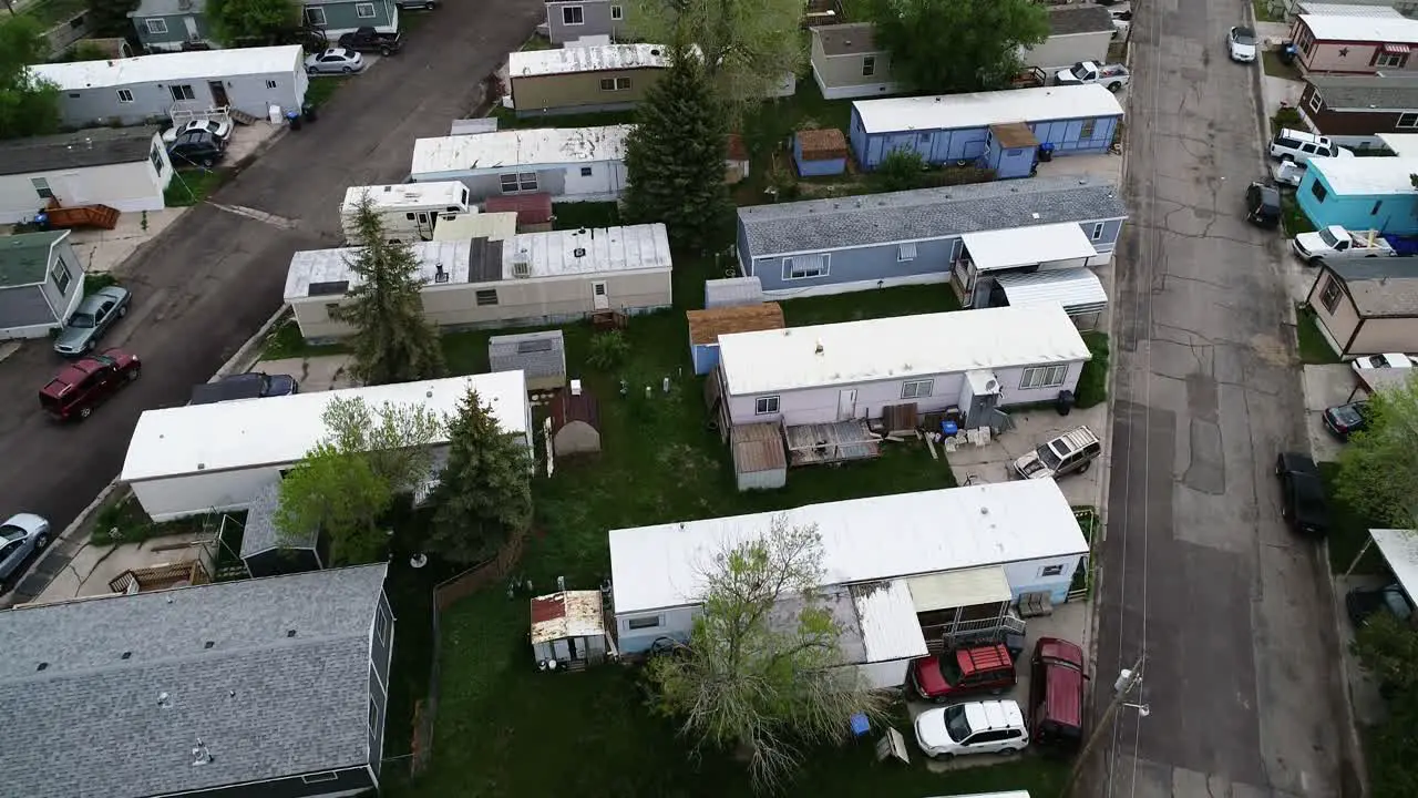 Run down single and double wide trailers in a mobile home park showing wealth disparity in 2021