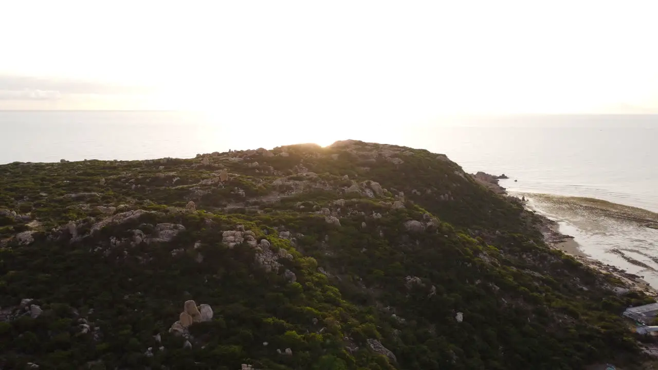 Pristine rocky coast of Ninh Thuan Vietnam calm sea waves at scenic sunrise