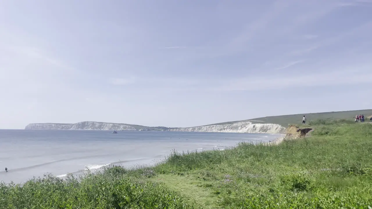 Slow panning shot of the beautiful seascape of the coast line on the island of Isle of Wight on a bright summers day