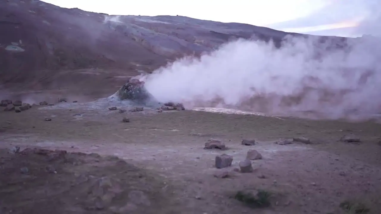 Hot spring with steam in mountains