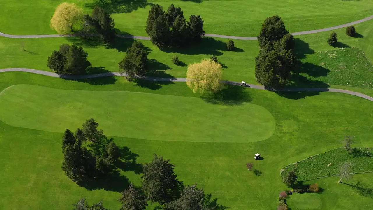 Panning aerial shot of a well maintained golf course