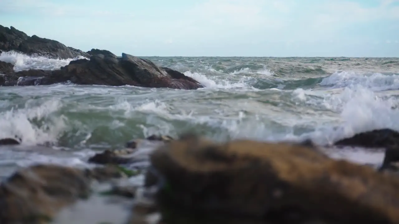 Waves hitting the rocks in slow motion