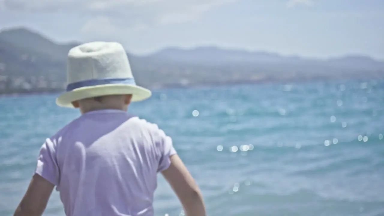 Three Years Old Kid Enjoys The Sea And The Waves At Kalamata Beach Greece SLOW MOTION