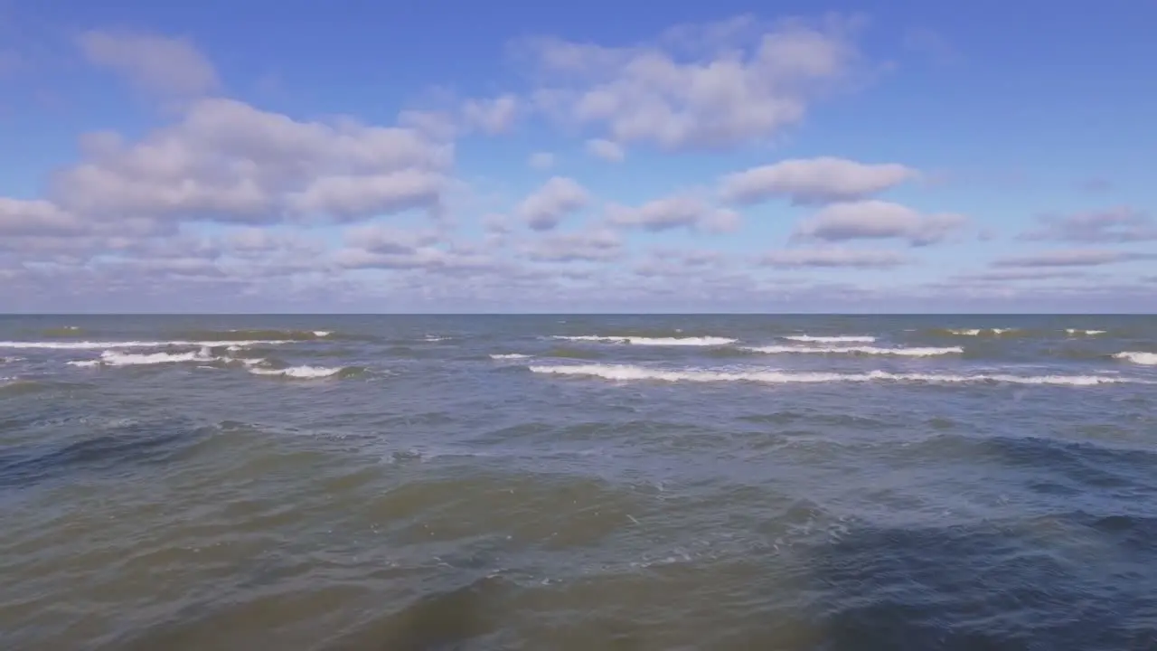 Baltic Sea Waves Rinse Seaside Beach At Sunrise