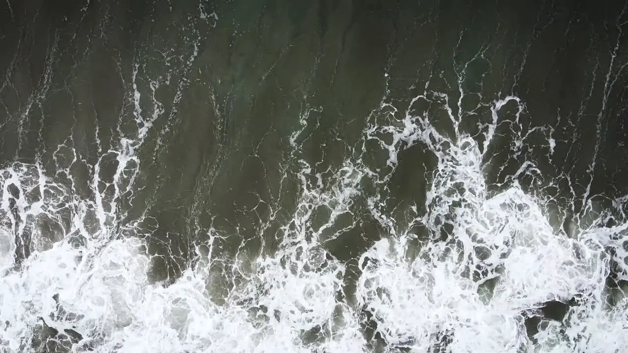 Overhead Shot Of Surfer Hit By Strong Wave And Riding Again His Board