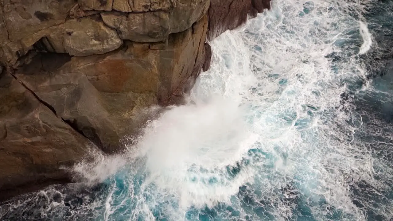 Panning shot with The Gap cliff in Western Australia near Albany located in Torndirrup National Park with deadly water waves and rocks