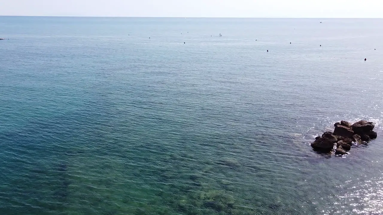 Zooming out aerial view of Castiglioncello coast side near famous Bagno Salvadori