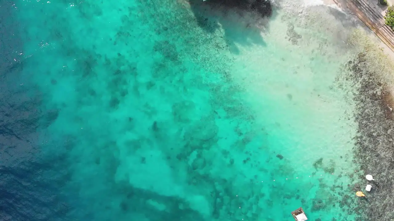 Cinematic aerial drone shot of iconic resort in philippines island with crystal clear blue water white sand and cliff jumping on hot sunny summer day-2