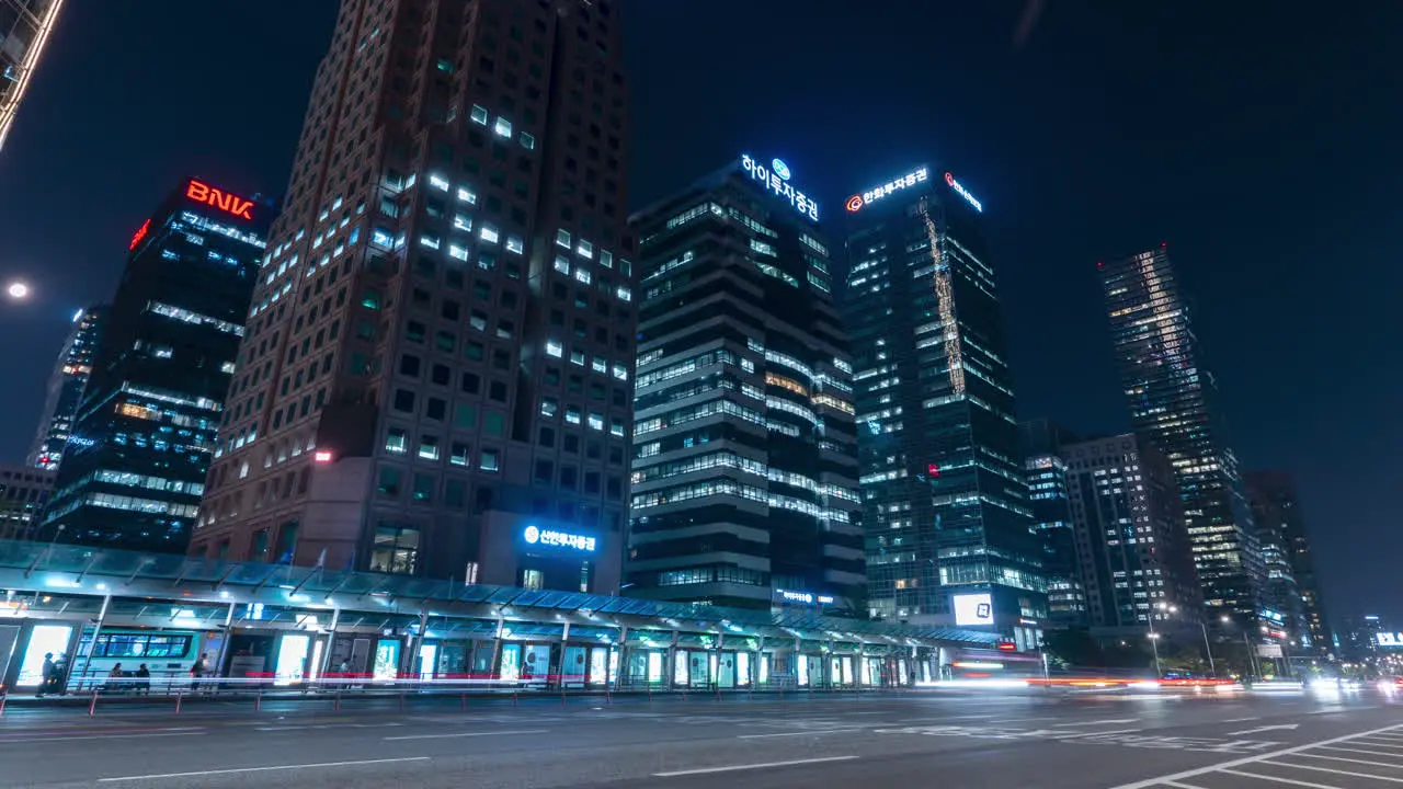 Yeouido Transfer Center and Nigth Traffic Time Lapse In Seoul Downtown HIgh-rise Towering Skyscrapers in Background wide low angle view zoom out