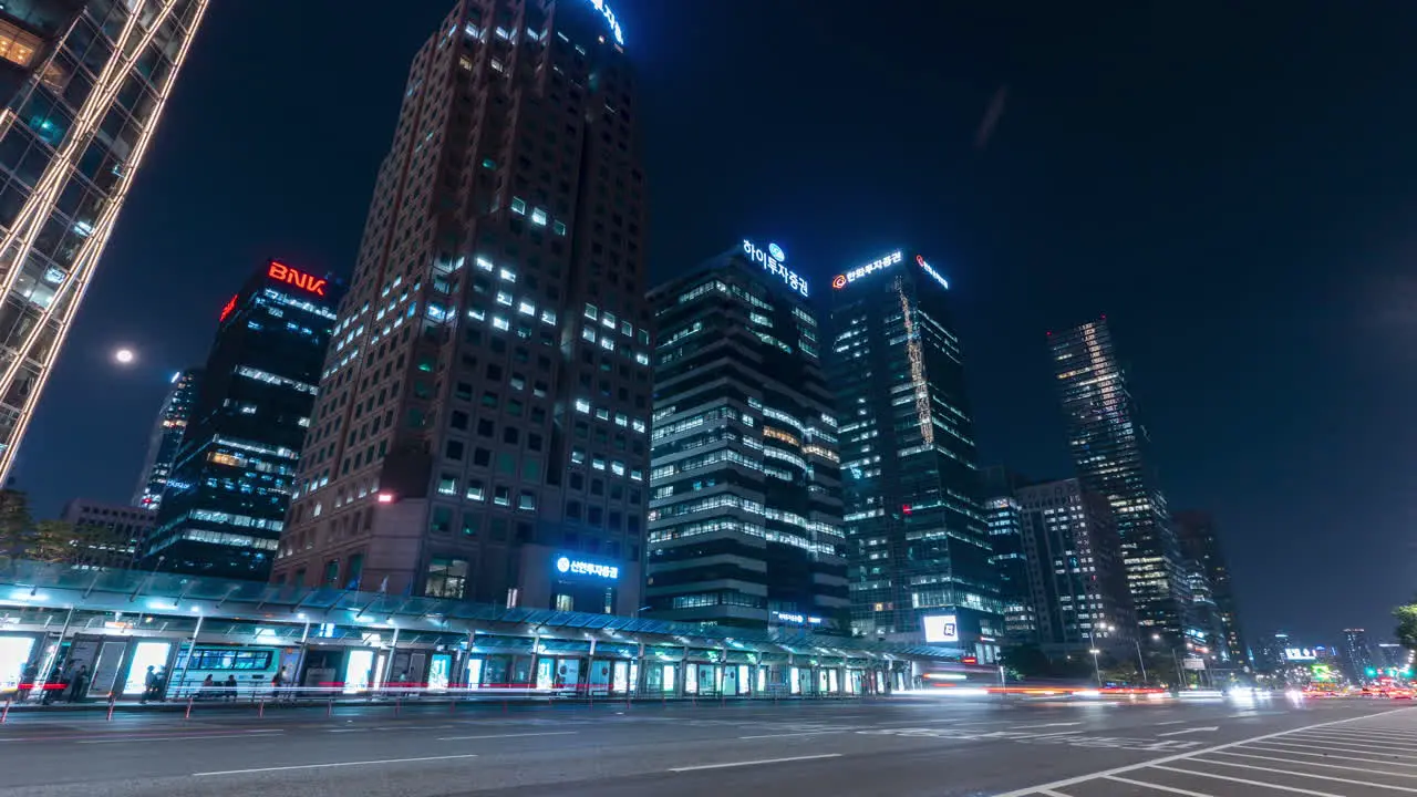 Night Traffic Near Bus Transfer Center and City Skyscraper Buildings in Yeouido Financial District static timalapse