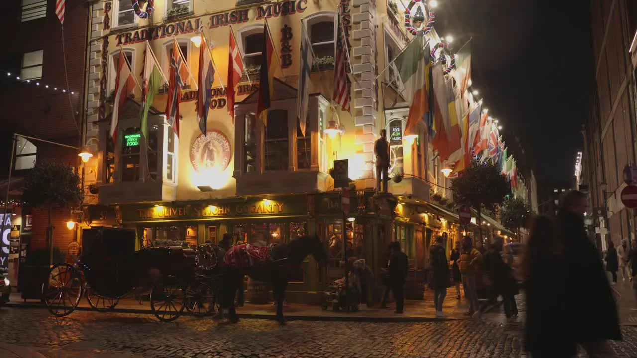 Tilt shot of the corner of the oliver pub during nighttime in Dublin Ireland