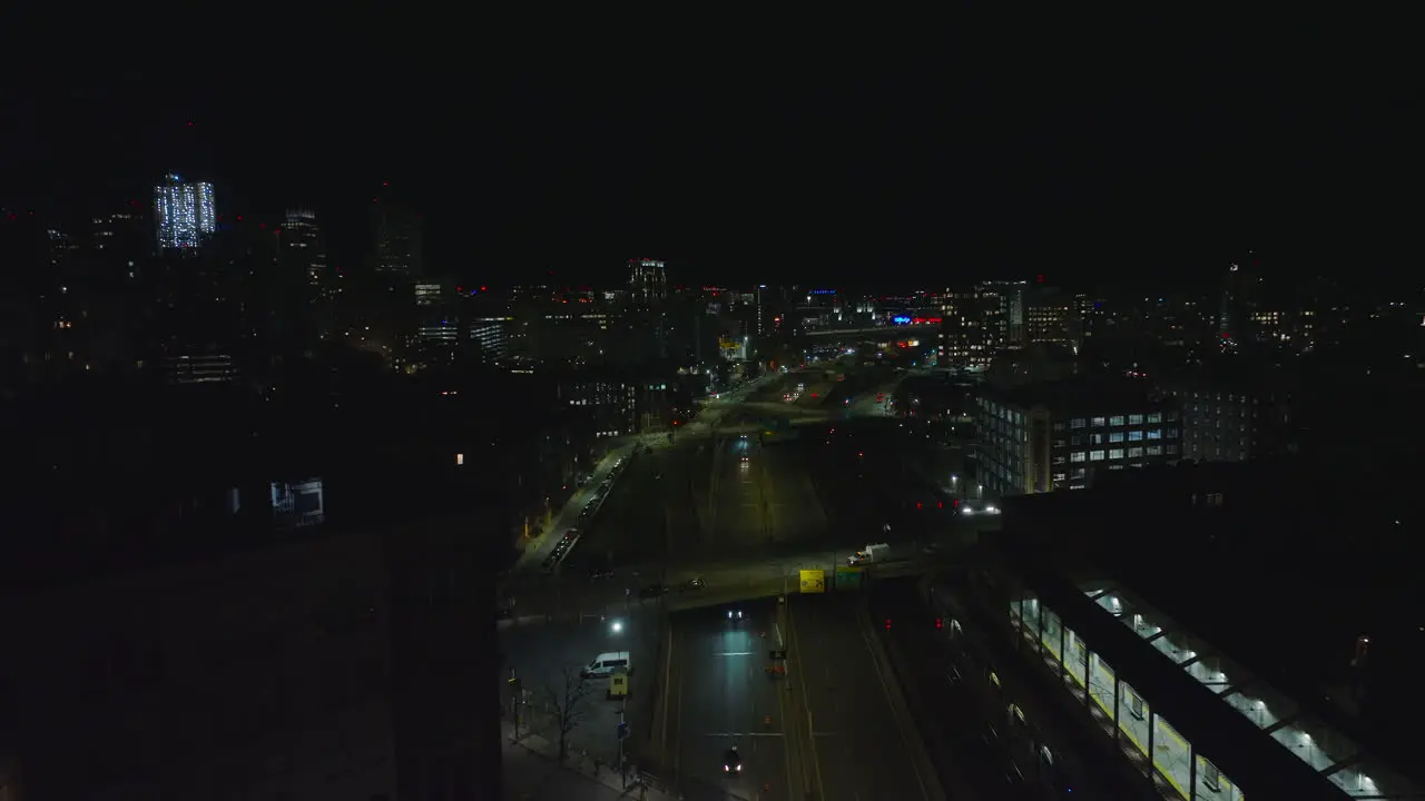 Aerial view of cars driving on multilane road in night city Forwards fly above trunk road Boston USA