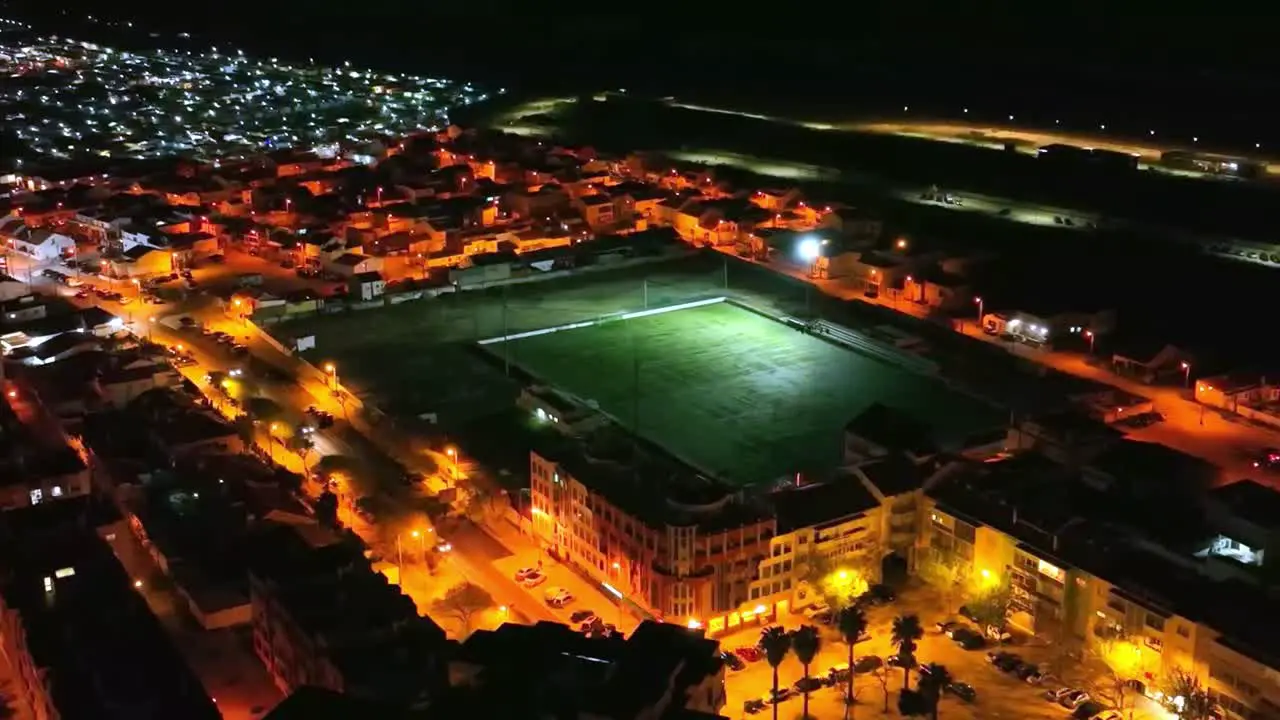 Drone footage of soccer field at night in Costa Da Caparica Portugal