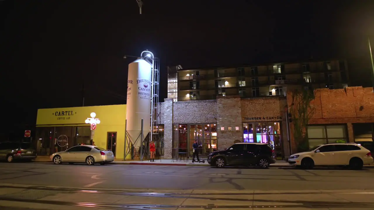 Storefront Of Coffee Shop And Brewery Along The Road In Downtown Tucson With Cars Parked At Night