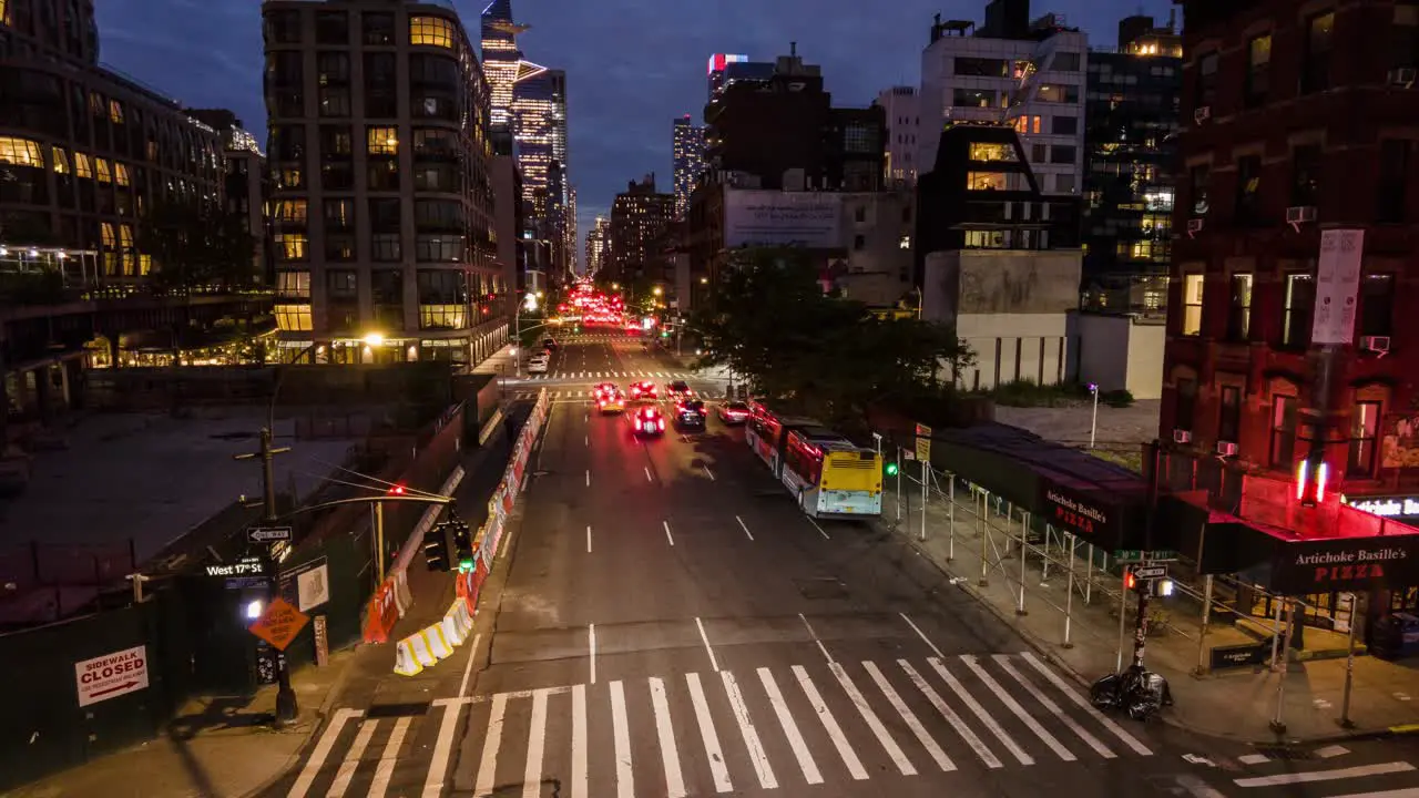 Timelapse and motionlapse from High Line Observation Deck new york 10th ave street at night with vehicular traffic and nightlife of downtown manhattan with buildings like the edge