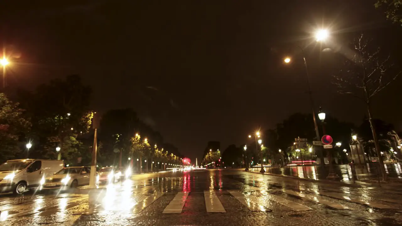 Car ride timelapse through Paris France at night captures the busy city with car lights street lights and buildings illuminating the scene