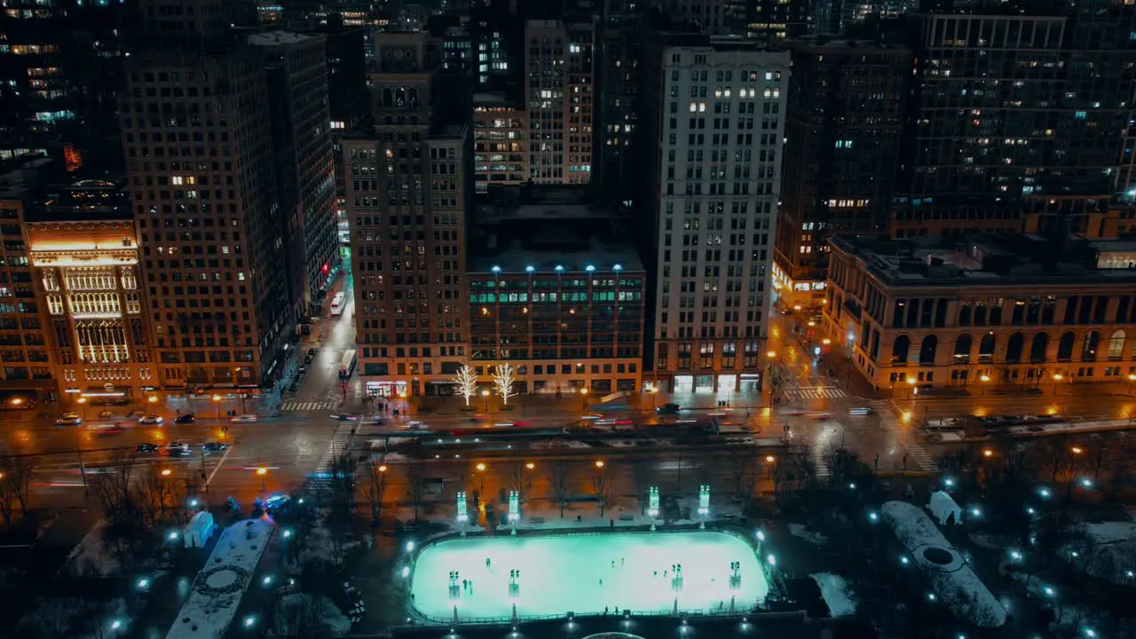 McCormick Tribune ice rink night winter chicago aerial timelapse paning left and right showing N Milwaukee Ave traffic