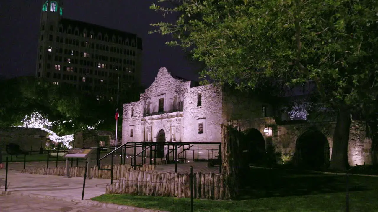 The Alamo at night in San Antonio Texas with gimbal video walking sideways by trees