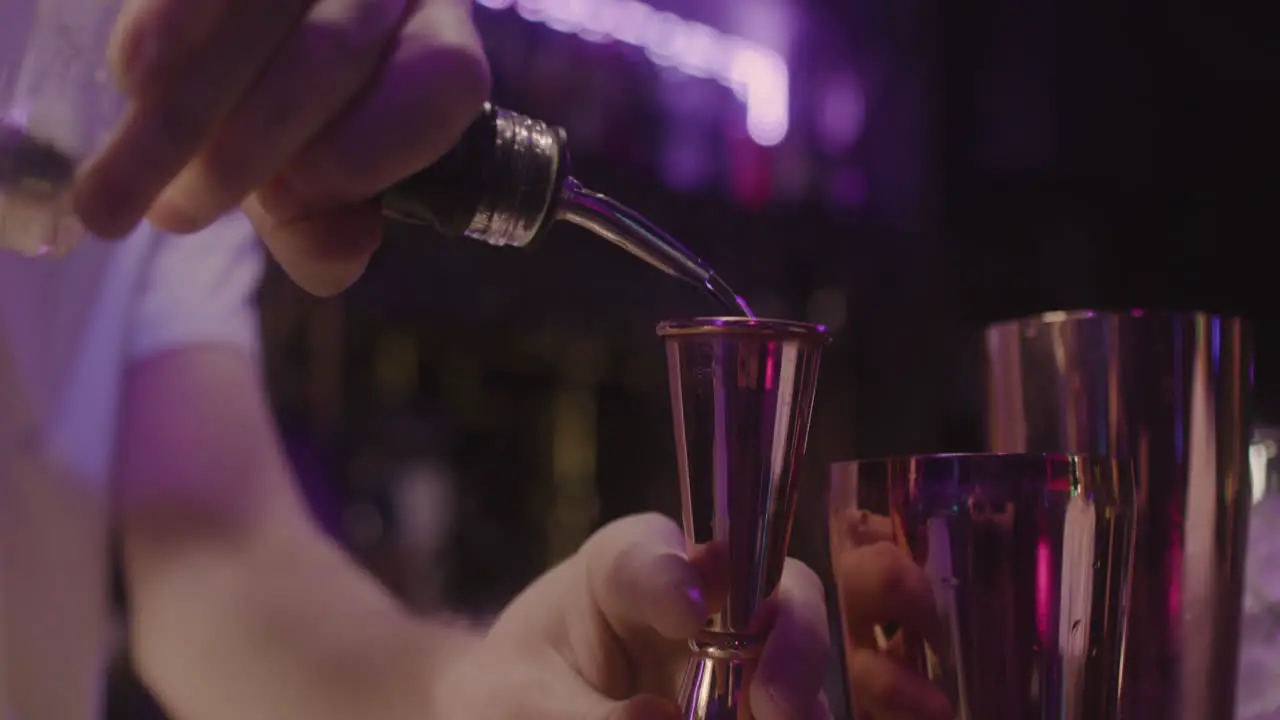 Close Up Of A Unrecognizable Bartender Preparing Drink Using A Cocktail Shaker