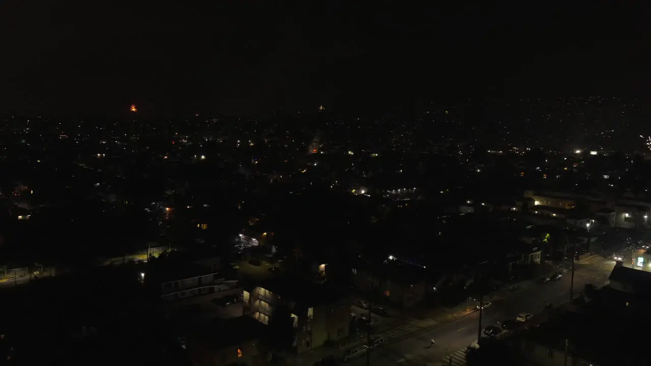 Fireworks above Oakland neighborhood at night